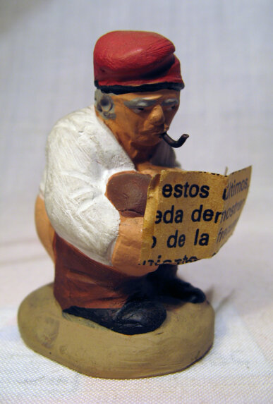 Caganer llegint el diari